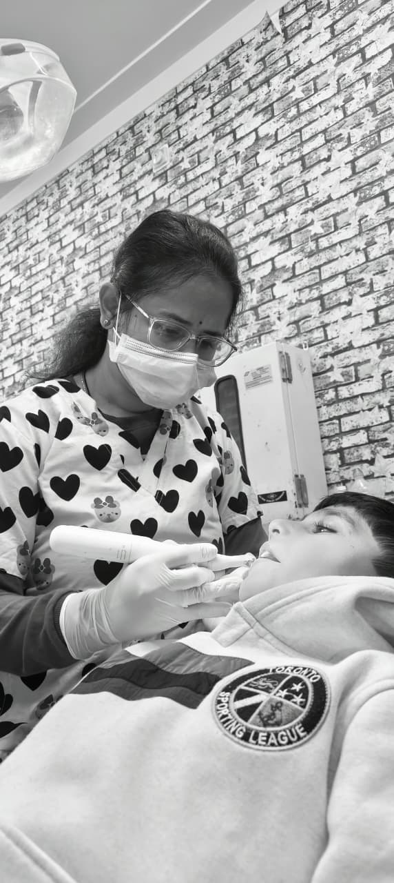 Dr. Mitrata during dental procedure