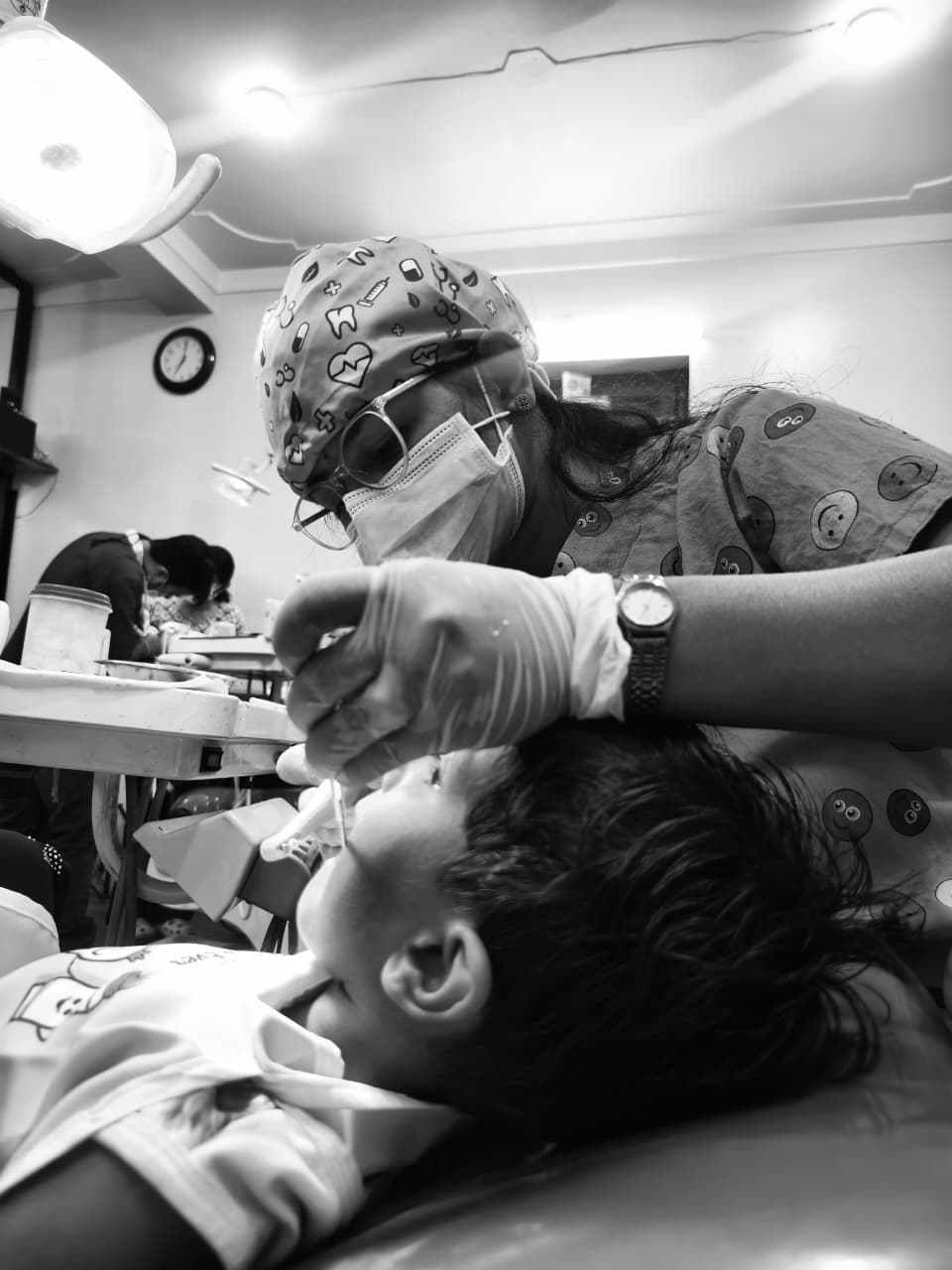 Dr.Mitrata during dental procedure